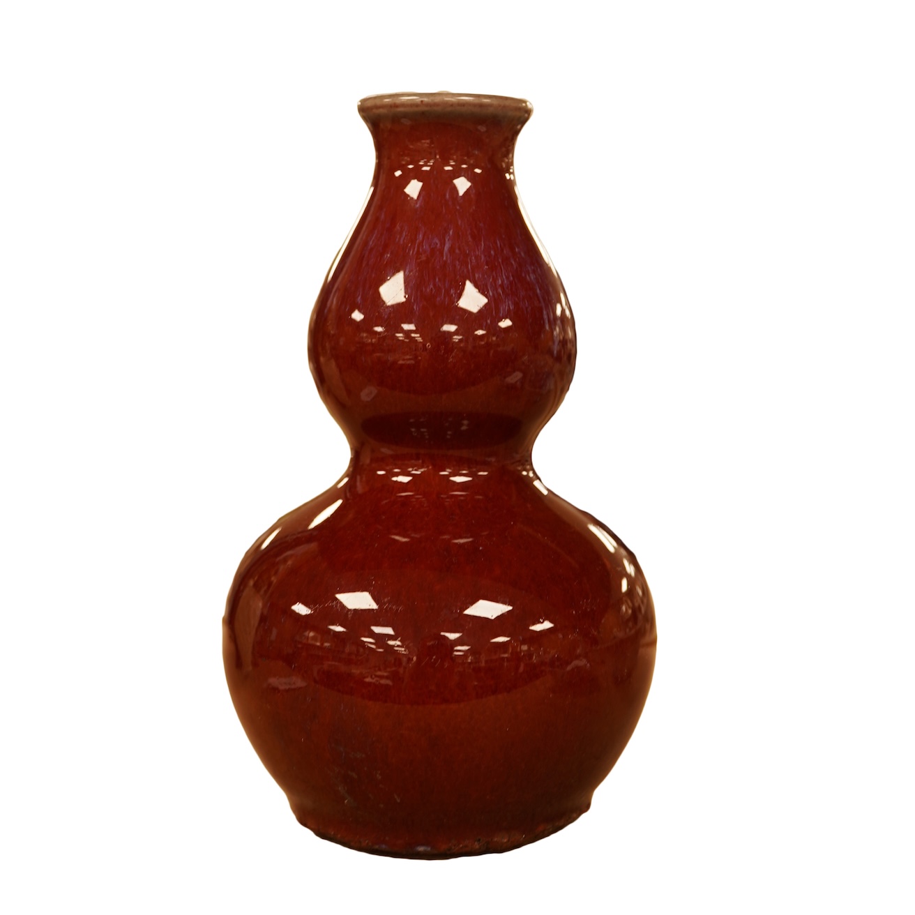 A Chinese Sang De Boeuf glazed double gourd vase, 14.5cm high